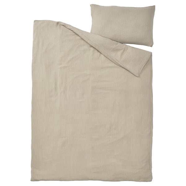The SCHERSMIN duvet cover set in light beige, made from breathable 100% organic cotton, featuring a simple, soft, and airy muslin texture.