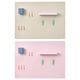 Option: Double light-colored and pink pegboards with various colorful hooks, clips, and a shelf, displaying organizational tools.