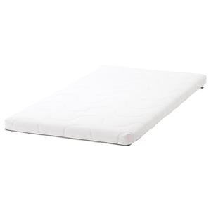 White SKÖNAST mattress, rectangular, foam-filled, zippered cover.