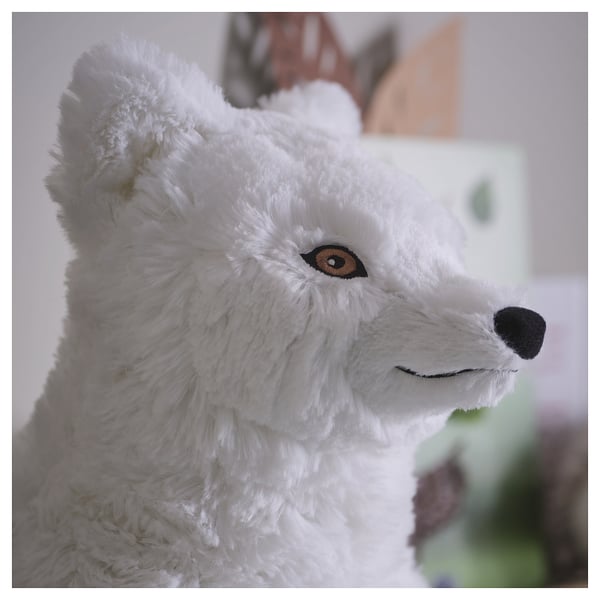 Soft plush arctic fox toy, white fur, dark eyes, high-quality materials.