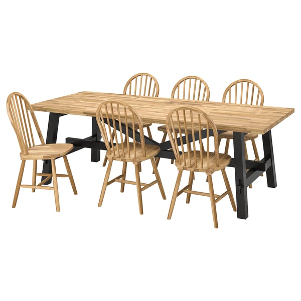 SKOGSTA dining set with rectangular acacia wood table and six spindle-back chairs.