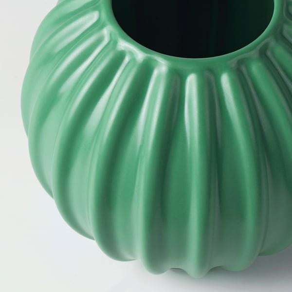 Green glazed stoneware vase with ridged texture, smooth opening, and matte finish.