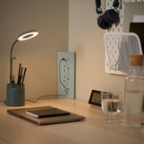 SKOTAT dark beige extension cord on desk, minimalist, eco-friendly recycled material.