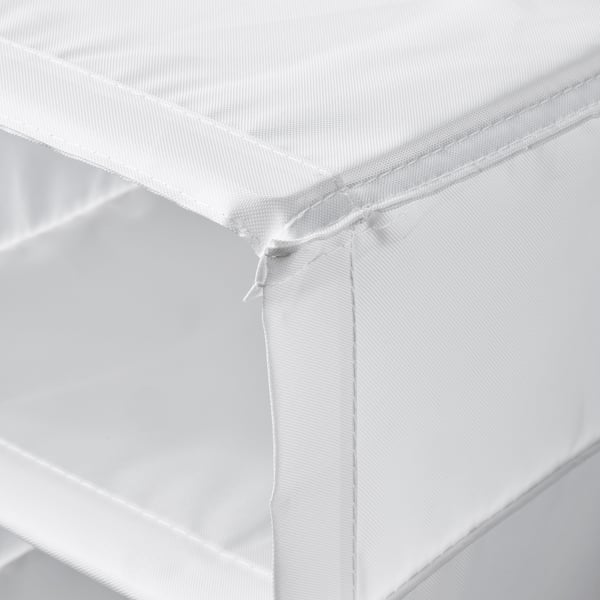 Close-up view of white shelf corner, showing sturdy edges and quality stitching.
