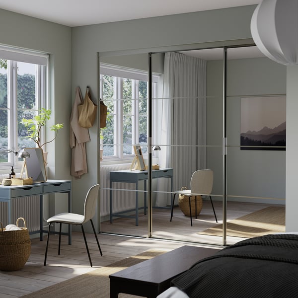 Bedroom with SKYTTA closet, desk, and cozy bedding.