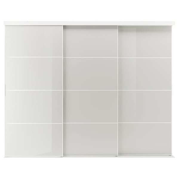 The SKYTTA is a sleek white sliding closet door system featuring a modern design with multiple glass panels framed in aluminum.