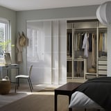 Modern bedroom: closet, clothes, chair, desk, window, bed.