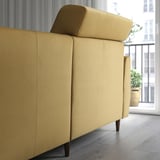 Modern yellow sofa with extendable back cushions for head support and removable chaise longue.