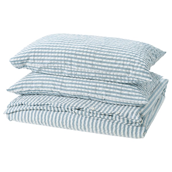 Folded blue and white striped bedding set with seersucker texture. Includes duvet cover and pillowcases, soft, breathable cotton blend.