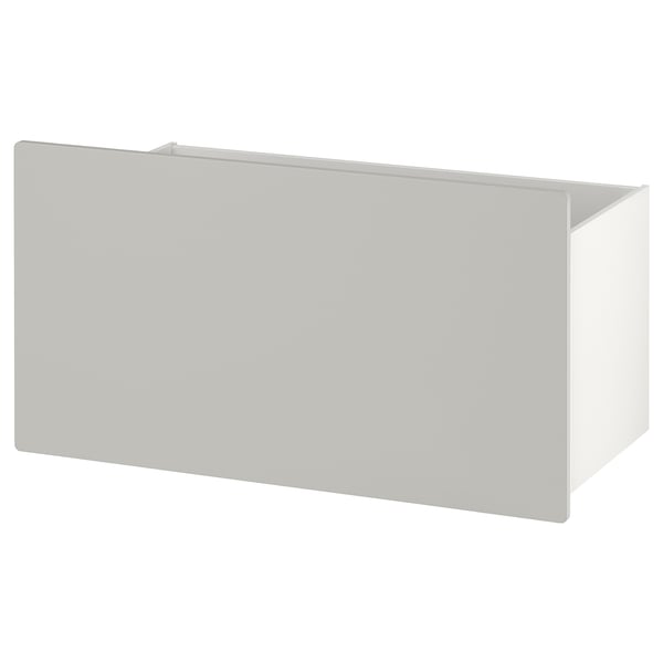 White boxy storage unit with angled top and smooth finish.