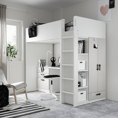 Modern white kids loft bed setup with desk, storage, and stairs. Bright, organized room with minimalist decor.