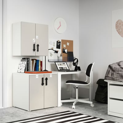 Modern white kids storage set, featuring cabinets, desk, and chair. Clean design with black accents. Holds books, toys, and more.
