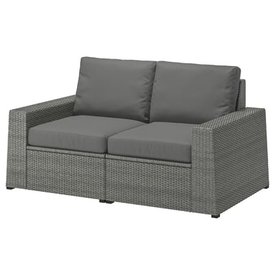 This image shows the SOLLERÖN outdoor sofa in gray. It gray cushions and a gray wicker design.