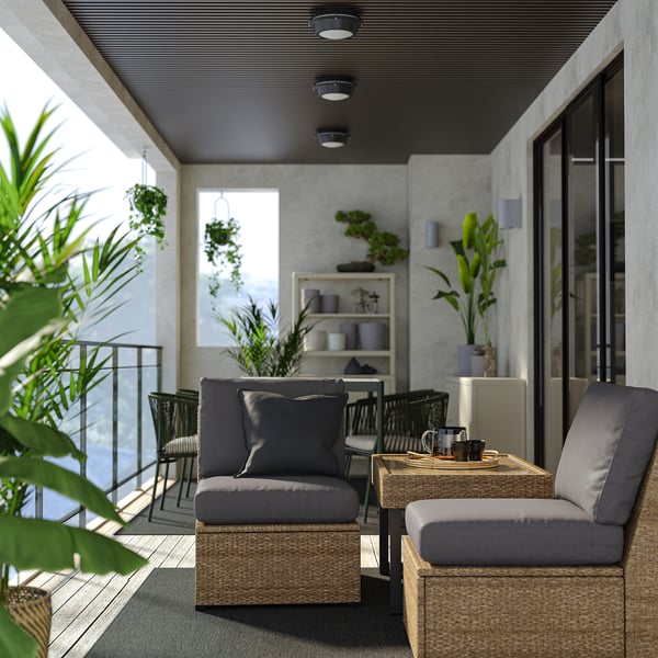 Modern patio: grey SOLLERÖN sectional, cushions, glass table, plants, sleek ceiling lights.