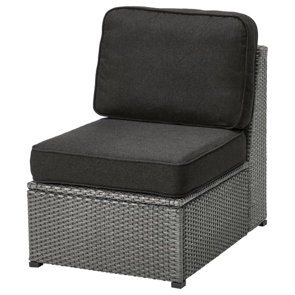 This image shows a grey SOLLERÖN outdoor chair with dark cushions. Its designed with a wicker-like texture and padded for comfort.