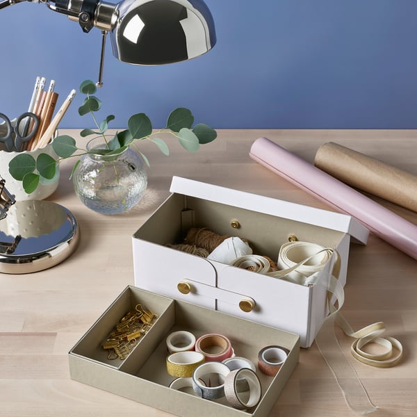 Desk with SPINNROCK organizer, lamp, and plant.