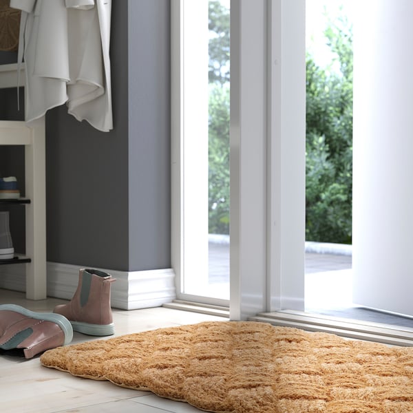 Natural coir doormat in entryway