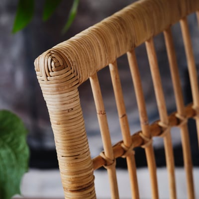 Stockholm wicker armchair, beige. Soft, rounded shape with plush cushion seat and back.