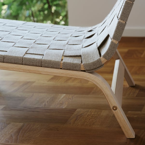 Unique woven linen chair, showcasing fine craftsmanship & robust design, perfect for comfort & style.