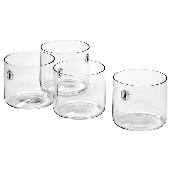 Four transparent STOCKHOLM 2025 glass cups. Mouth-blown, sleek, straight design, clear color, modern style.