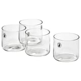 Four transparent STOCKHOLM 2025 glass cups. Mouth-blown, sleek, straight design, clear color, modern style.