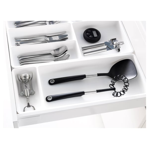 Kitchen drawer organizer with compartments for utensils, gadgets, and tools.