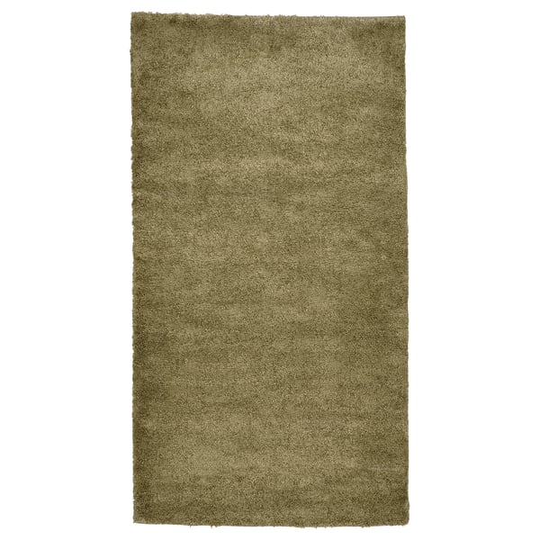 Displays a rectangular, olive green STOENSE area rug with a soft, thick pile and a subtle sheen, perfect for cozy, sound-dampened spaces.