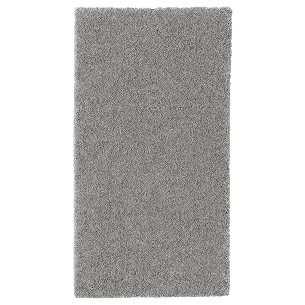 Gray rectangular STOENSE rug with soft, thick pile for comfort and sound dampening.