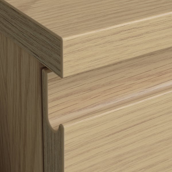 Close-up of high-quality wooden furniture edges. Visible smooth finish, tight grain, and clean joins indicating durability and precision.
