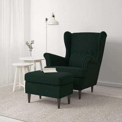 STRANDMON chair & footstool on rug. Alternate suggestion: STRANDMON chair/footstool near lamp.
