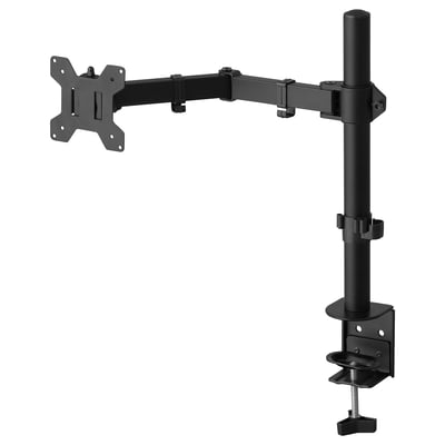 The STUBBERGET monitor arm, black, holding a screen, mounted on a desk with a clamp.