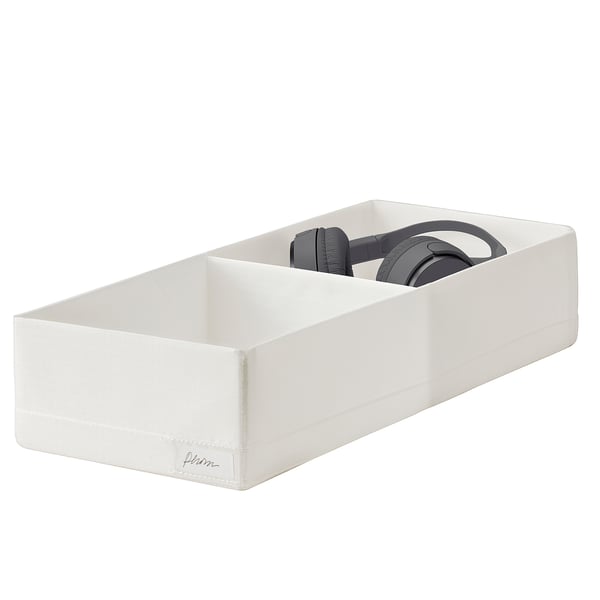 White STUK box with gray headphones inside.