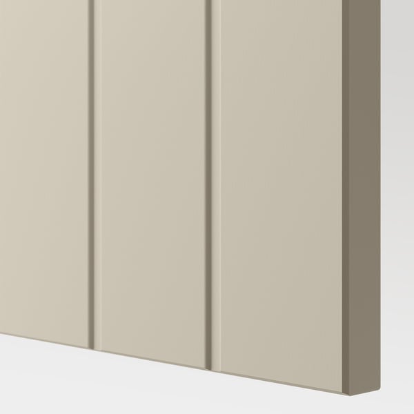 Beige cabinet front with three vertical panels, showcasing smooth texture and quality design.