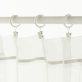 White curtain rings with hooks, hanging sheer white curtains.