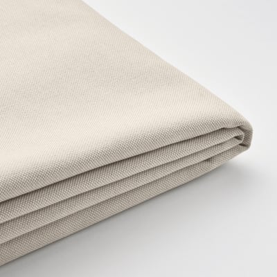 Folded beige fabric on white background, showing smooth texture and quality weave.