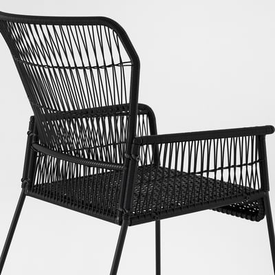 TALLSKÄR chair, black, woven rattan, outdoor, with armrests.