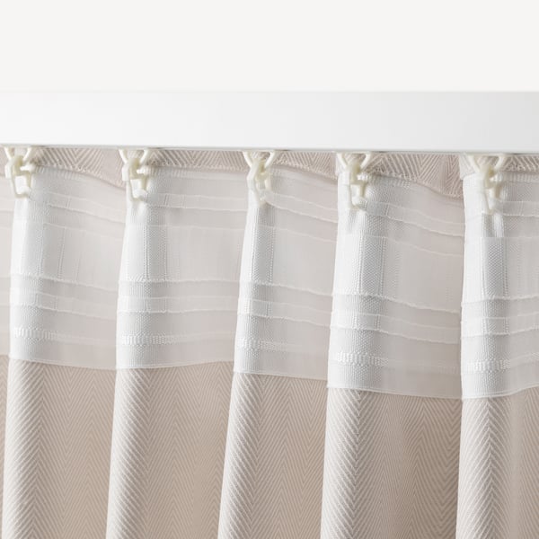 White striped curtains hang with hooks, easy to hang and provide privacy with diffused light.