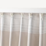 White striped curtains hang with hooks, easy to hang and provide privacy with diffused light.