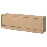 A TONSTAD tv bench in oak veneer with sliding doors, designed for cable management and adjustable shelves.