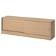 A TONSTAD tv bench in oak veneer with sliding doors, designed for cable management and adjustable shelves.