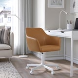 TOSSBERG tan leather swivel chair beside desk, smaller than lamp.