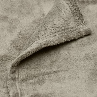 Grey recycled fleece blanket, folded neatly.