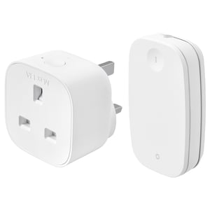 Two white ikea TRETAKT smart home devices: a compact square plug and a slim rectangular remote control.