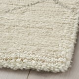 Close-up of TVERSTED rug corner, dense, soft texture, neutral color, plush material.