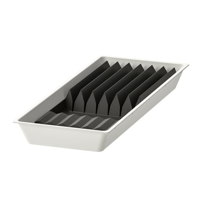 Rectangular white plastic organizer with black rubber inserts, divided for knife storage.