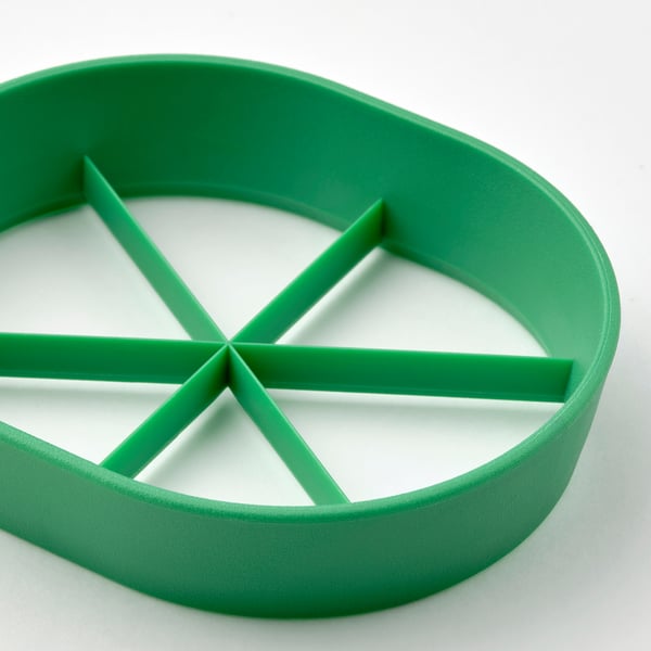 Bright green egg slicer with star-shaped cutters, dishwasher safe, easy grip.
