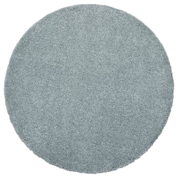 Round, light blue, shaggy rug. Made from polypropylene, soft and plush texture.