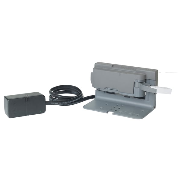 The UTRUSTA push opener device: grey, rectangular box with power adapter and cord.