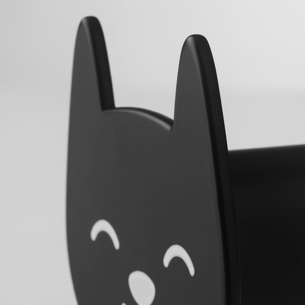 Black cat-shaped hook with white smiling eyes, perfectly crafted and modern, ideal for practical and decorative use.