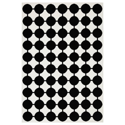 VÄNDPLATS black-white dotted rug, modern geometric pattern, rectangular shape, soft low pile, made of polypropylene.